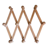 Accordion wall coat rack