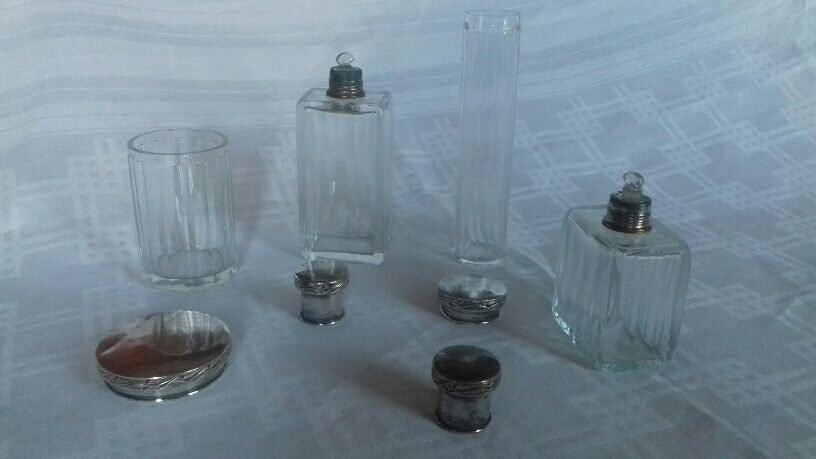 Lot of 4 glass toilet bottles, silver metal caps