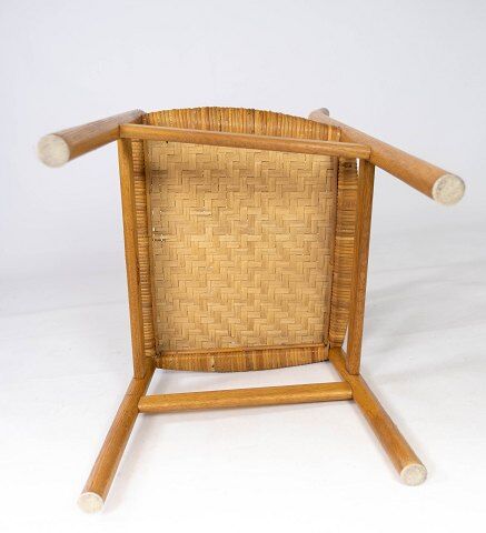 A set of four dining room chairs in oak and seat in papercord, designed by Børge Mogensen