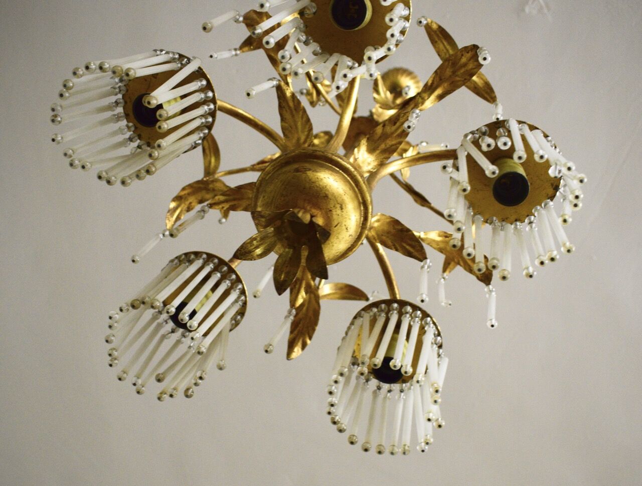 Golden metal chandelier in crystal pendants