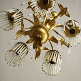 Lustre en métal doré en pendeloques en cristal
