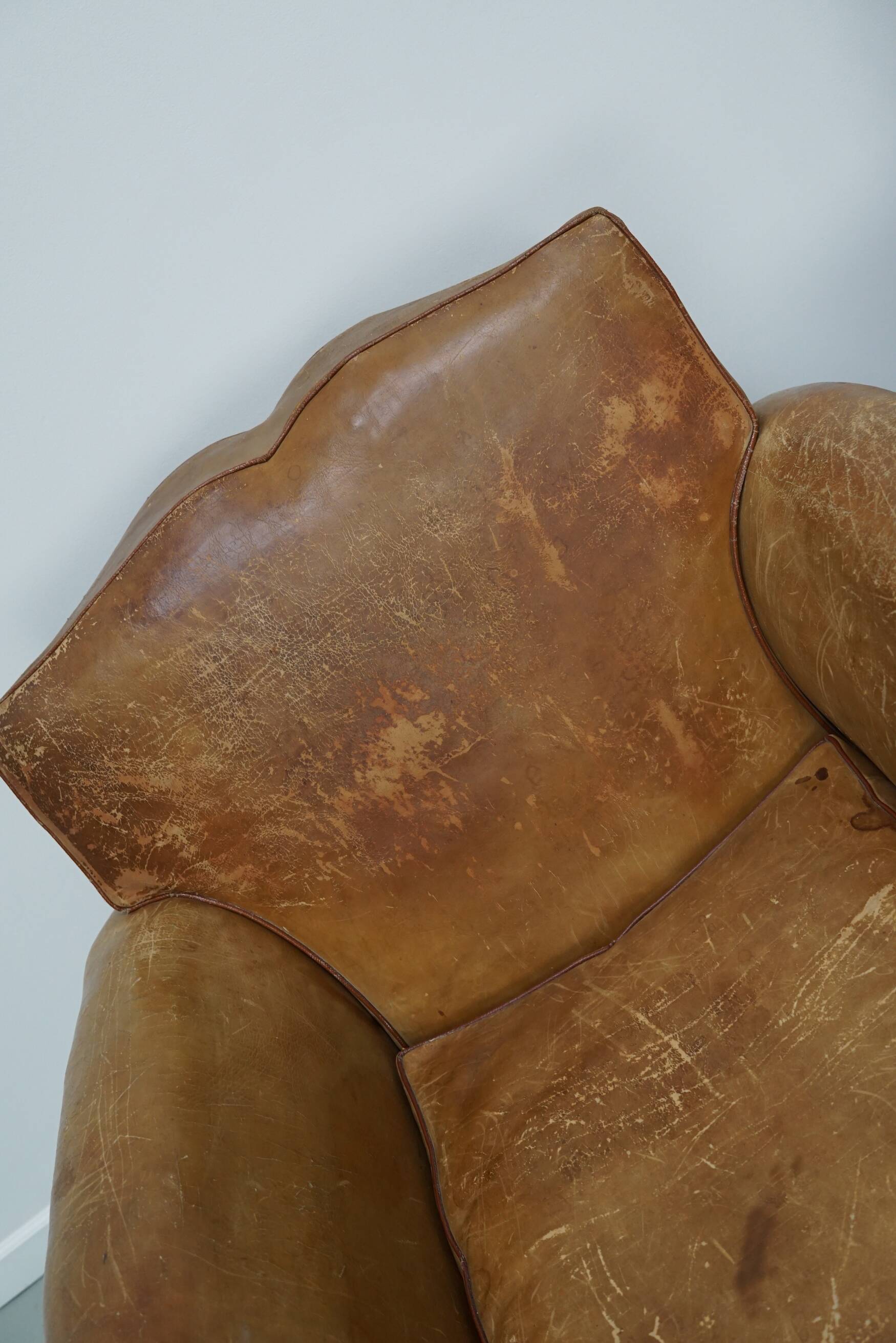 Pair of French club chairs with moustache back in cognac leather, 1940s