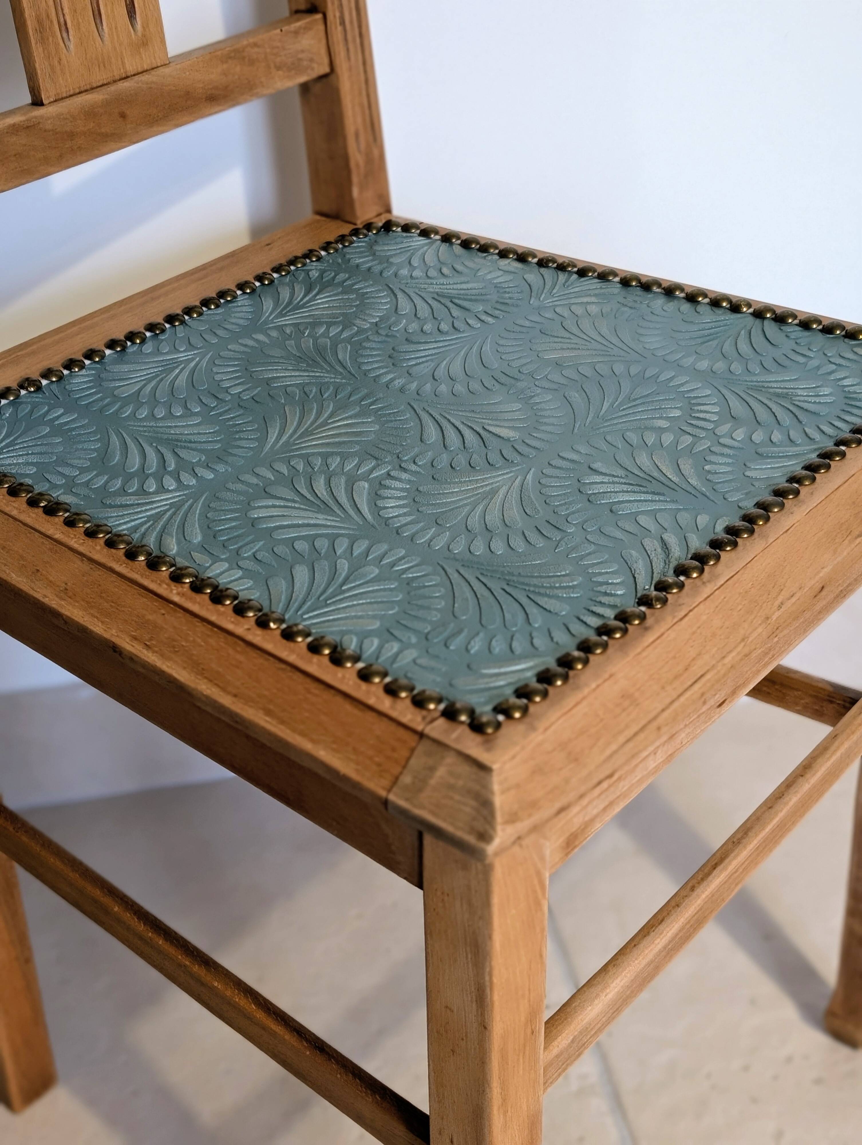 Revisited antique chair in solid wood with a sage green seat.