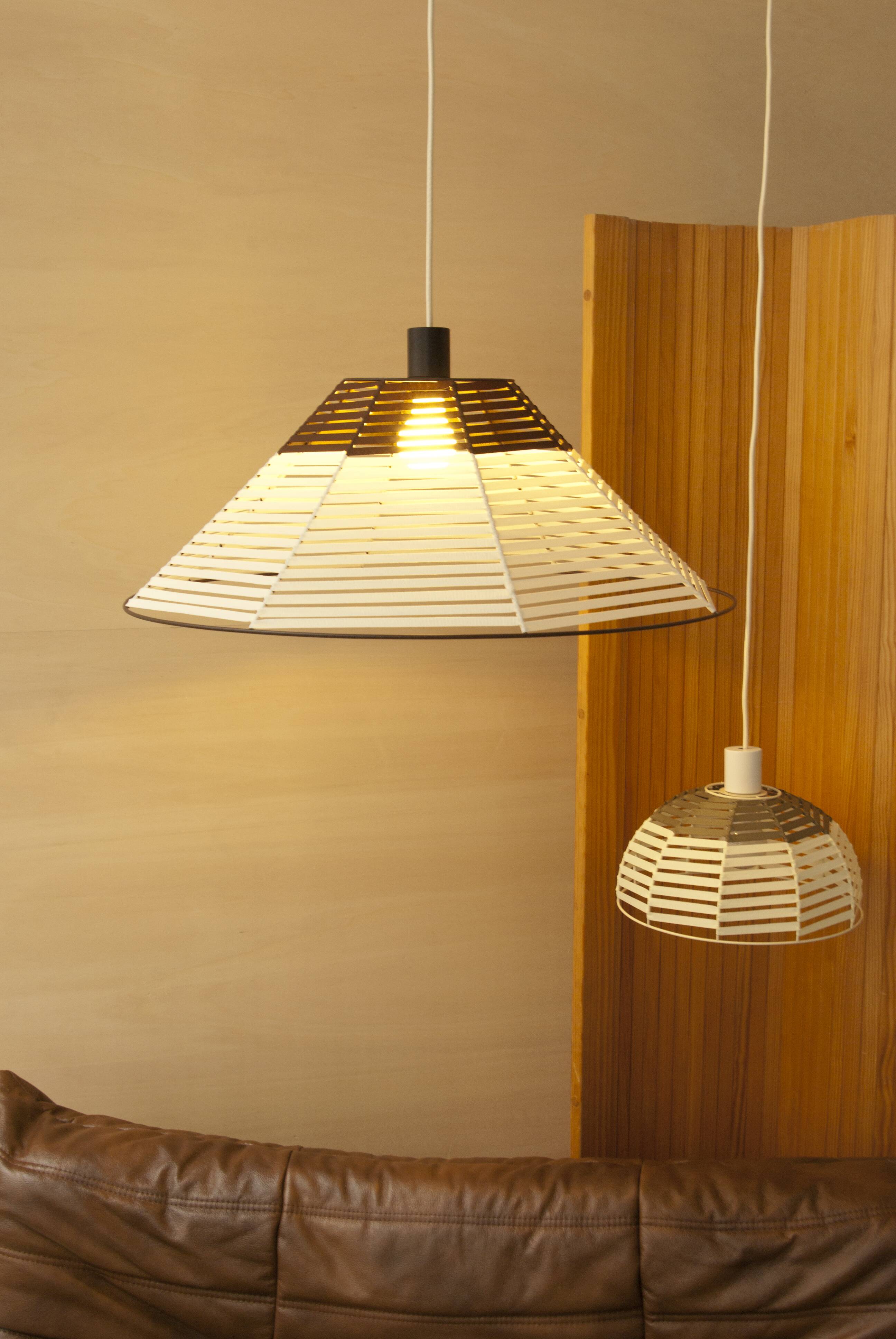 Woven bell suspension on metal structure.