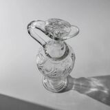 Vintage pressed glass carafe from the 1960s, clear sculptural glass with textured patterns and a stopper.