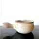 Beige glazed terracotta caquelon