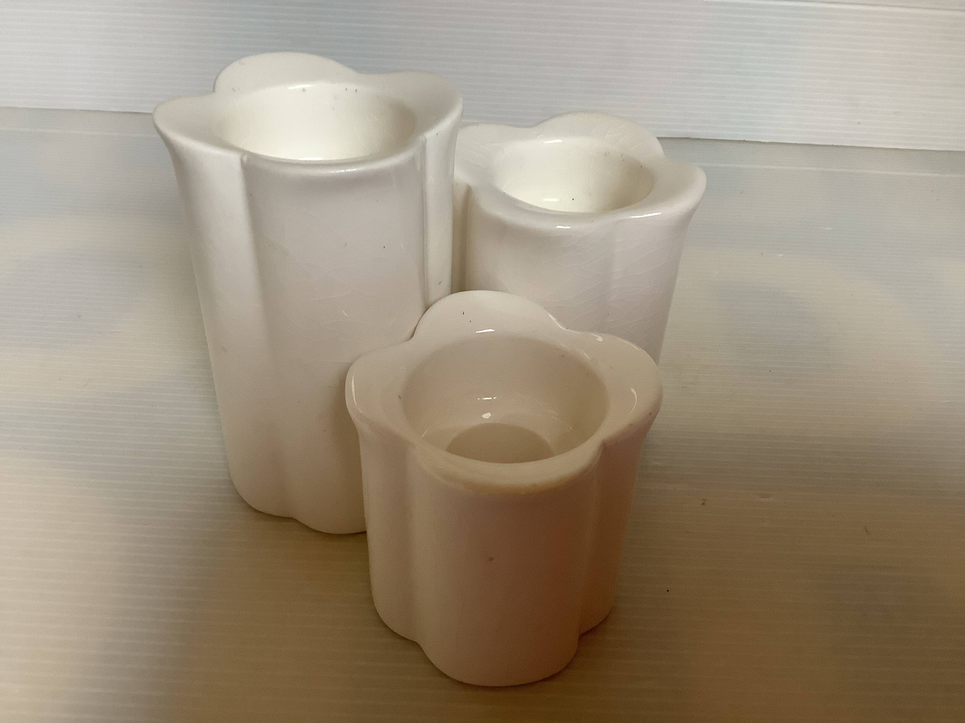 Trio of four-leaf clover candle holders