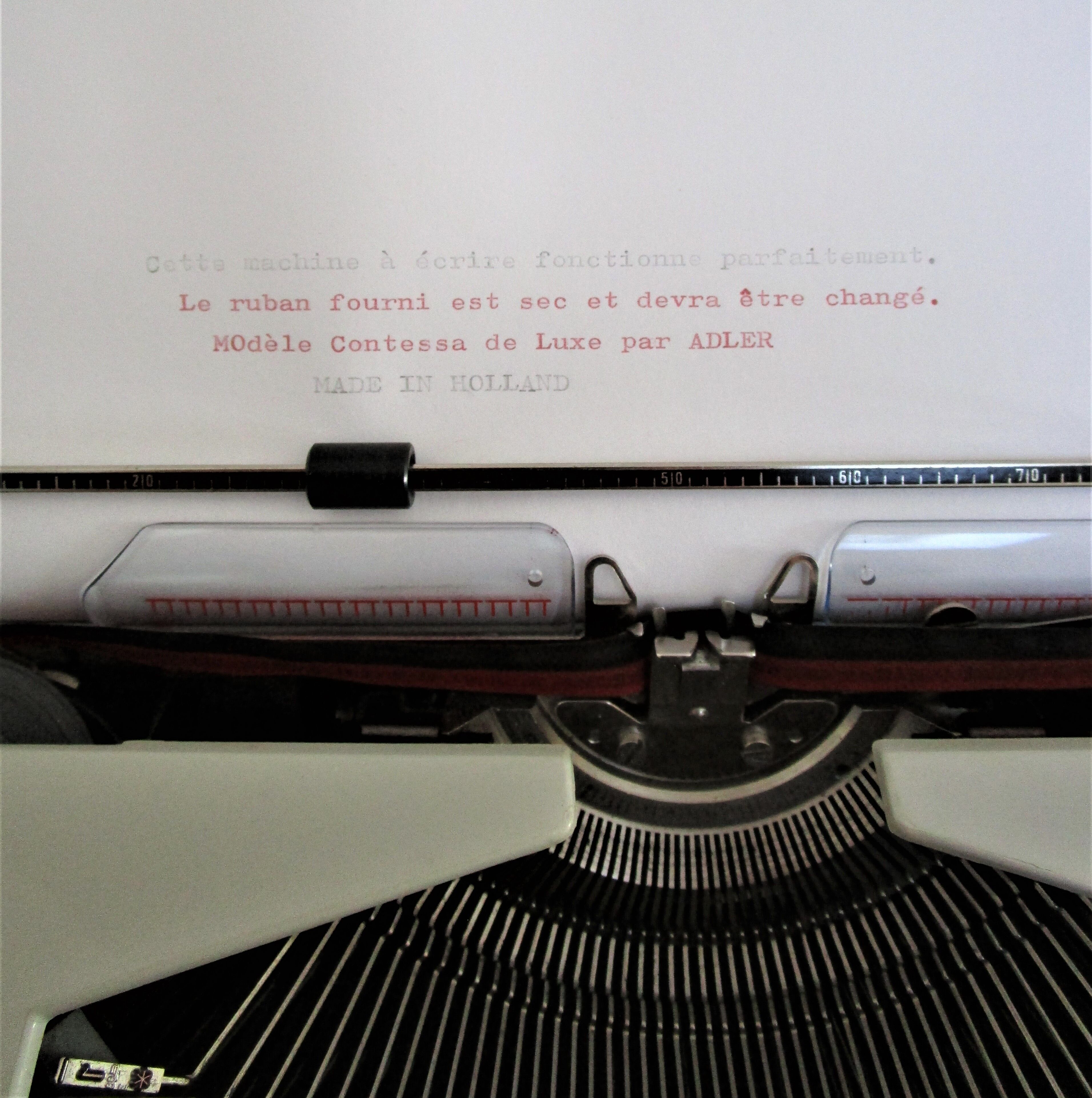 Writers' typewriters of light grey 70s Adler made in Holland