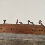 Wooden wall-mounted coat rack