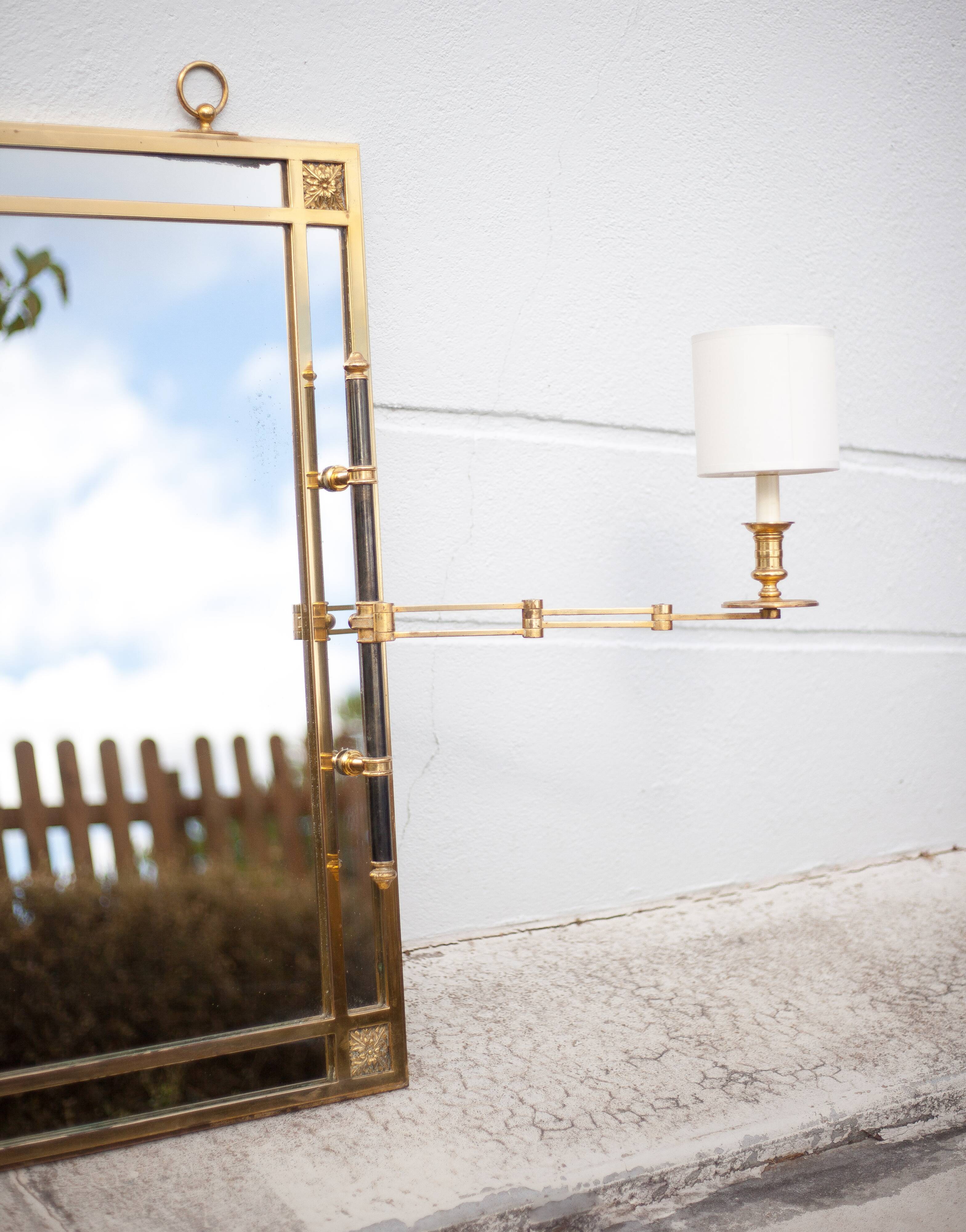mirror with articulated wall light
