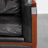 Black cowhide leather and wooden Art Deco design armchair