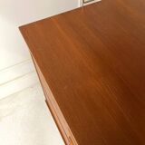 A piece of furniture combining a desk, wardrobe, and shelves.