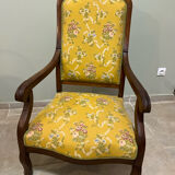 Louis XV style cabriolet armchair in solid wood, yellow floral fabric.