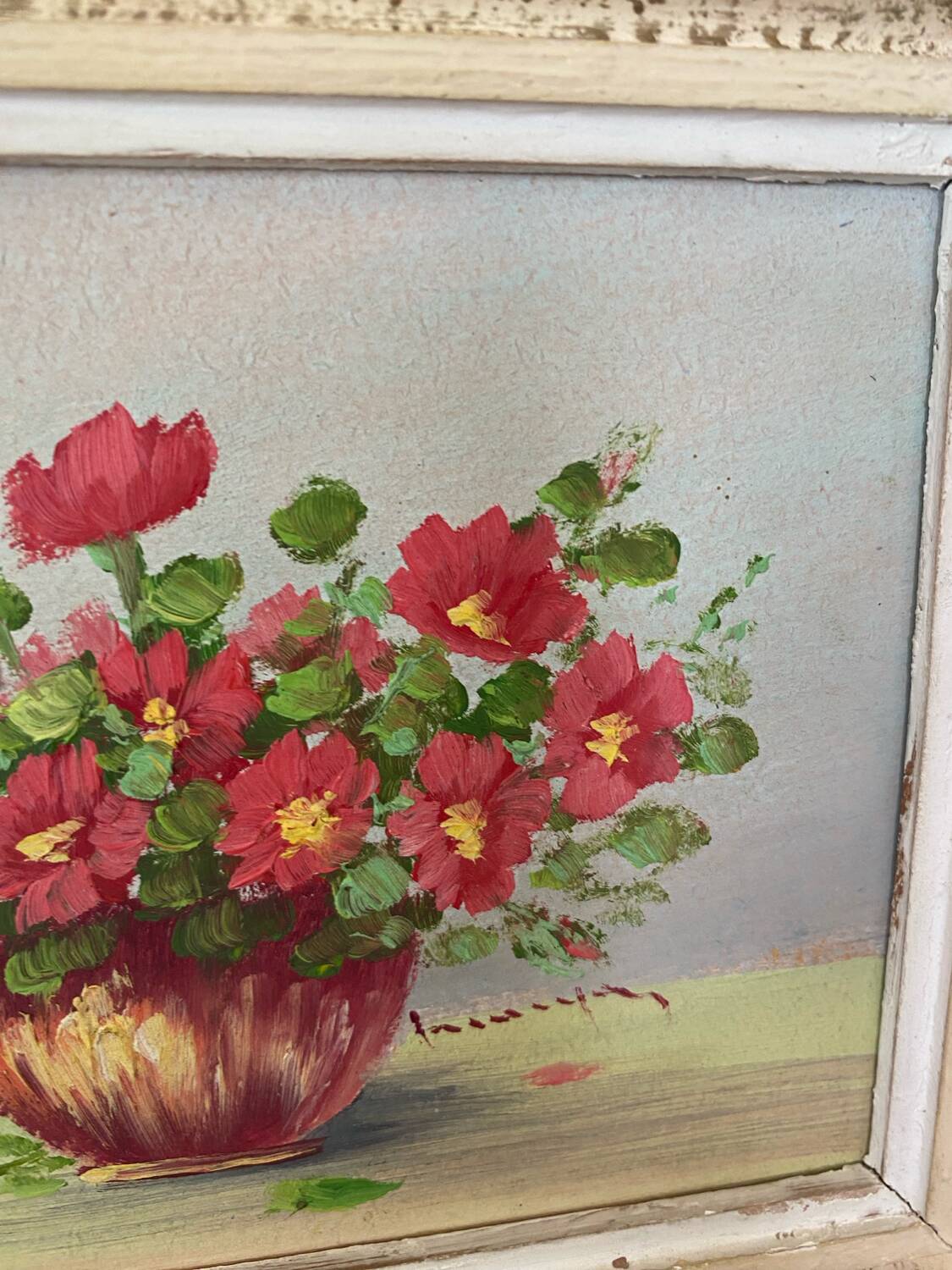 Oil painting red country flowers in a vase.