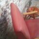 Red armchair with compass feet 50s