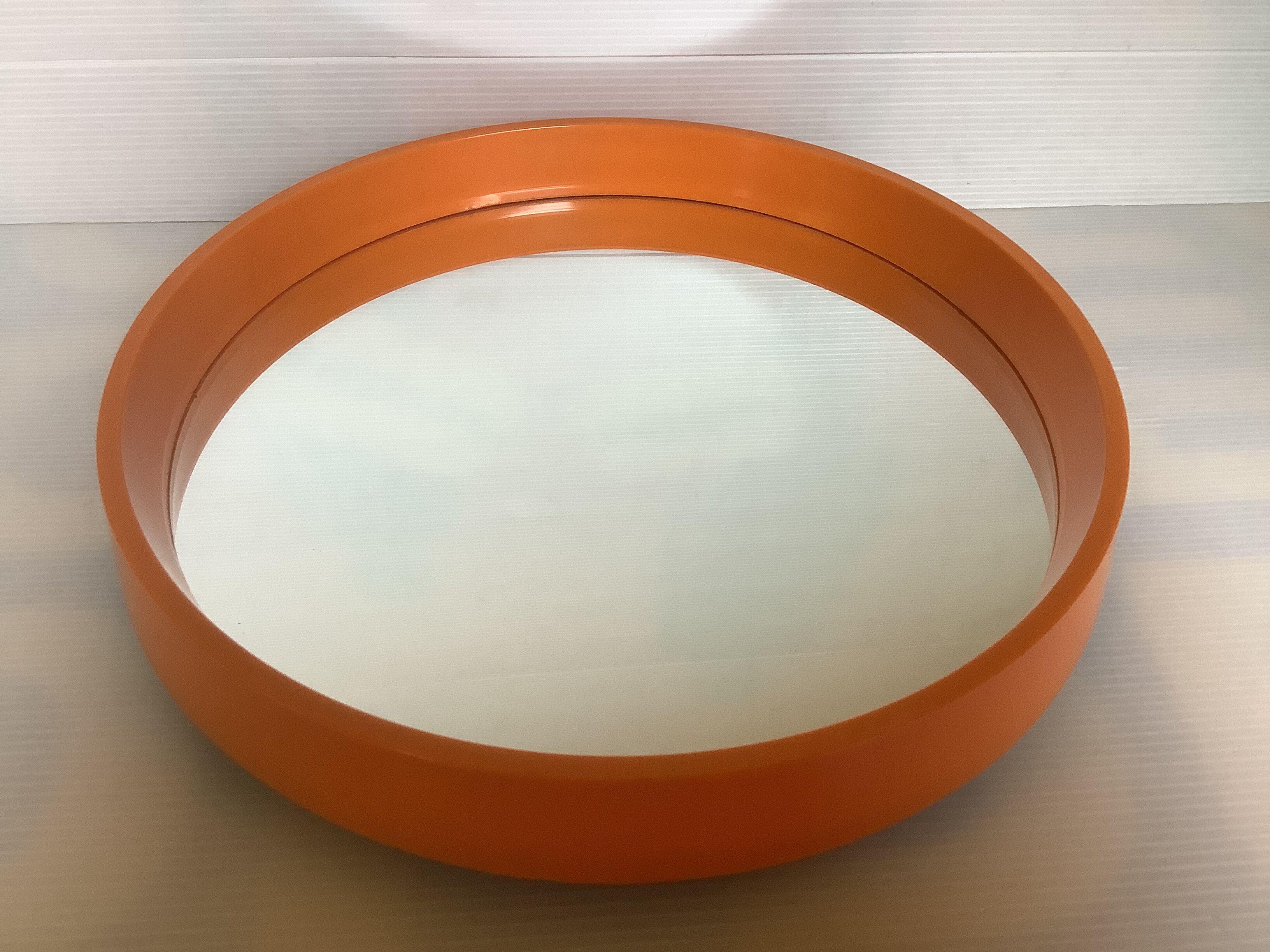 Old vintage orange round mirror