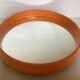 Old vintage orange round mirror