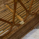 Vintage rattan baby cot on wheels.