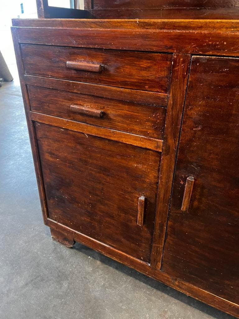Vintage wooden display cabinet with yellow glass.
