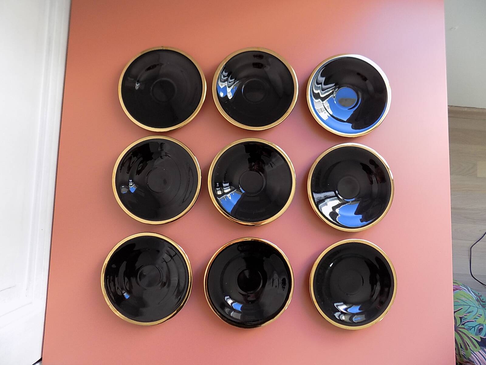 set of 9 black and gold Salins cups and saucers