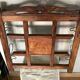 Art Deco wall-mounted coat rack in oak, early 20th century. Beveled central mirror