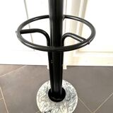 Black metal parrot coat rack on marble base