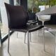 Brown leather chairs and Zanotta metal legs