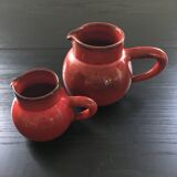 Pair of red pitchers