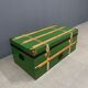 Green metal trunk with wooden sleds