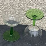 5 transparent glass glasses and green glass vase go