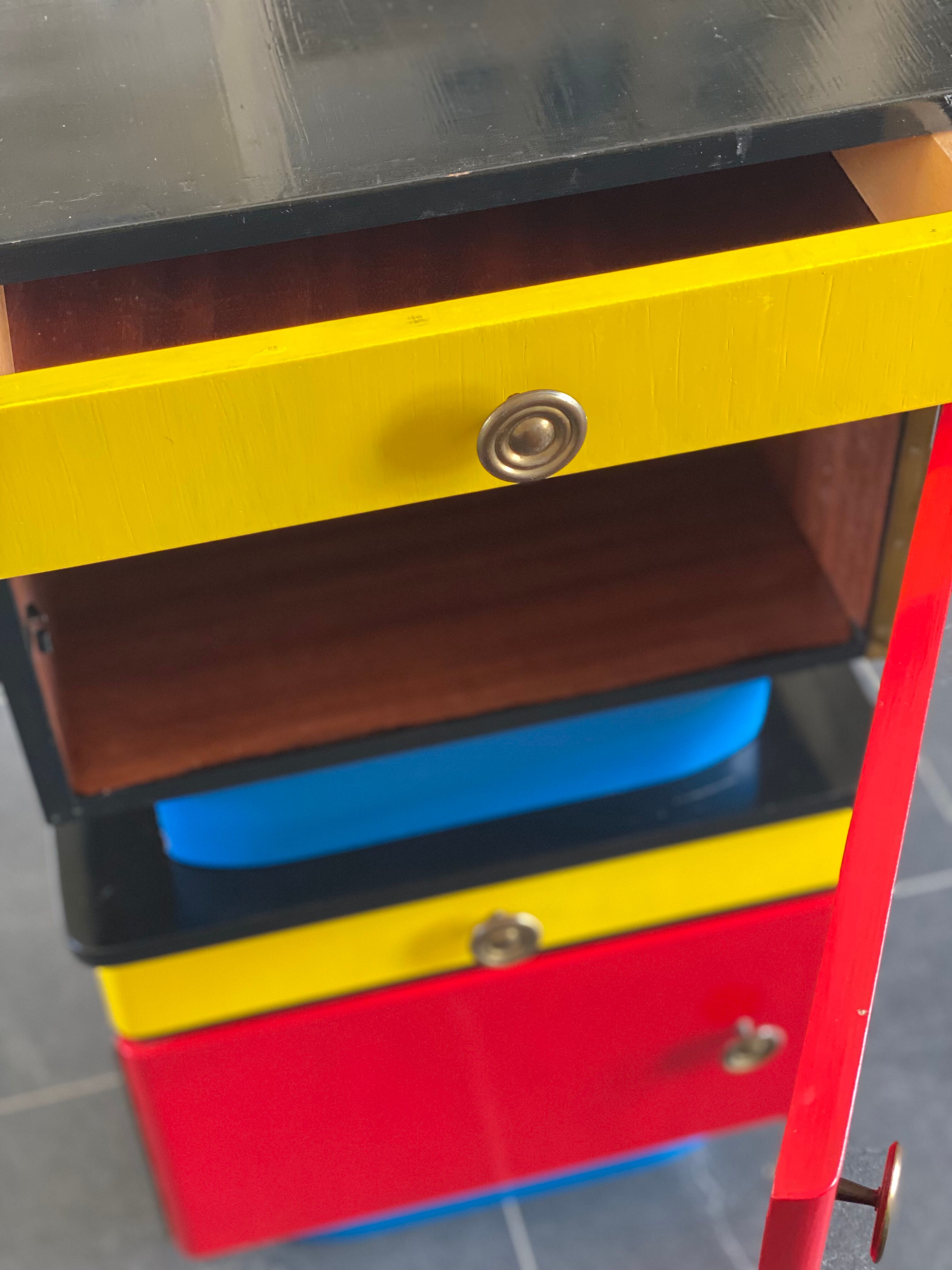 Pair of colorful massive teak night stands