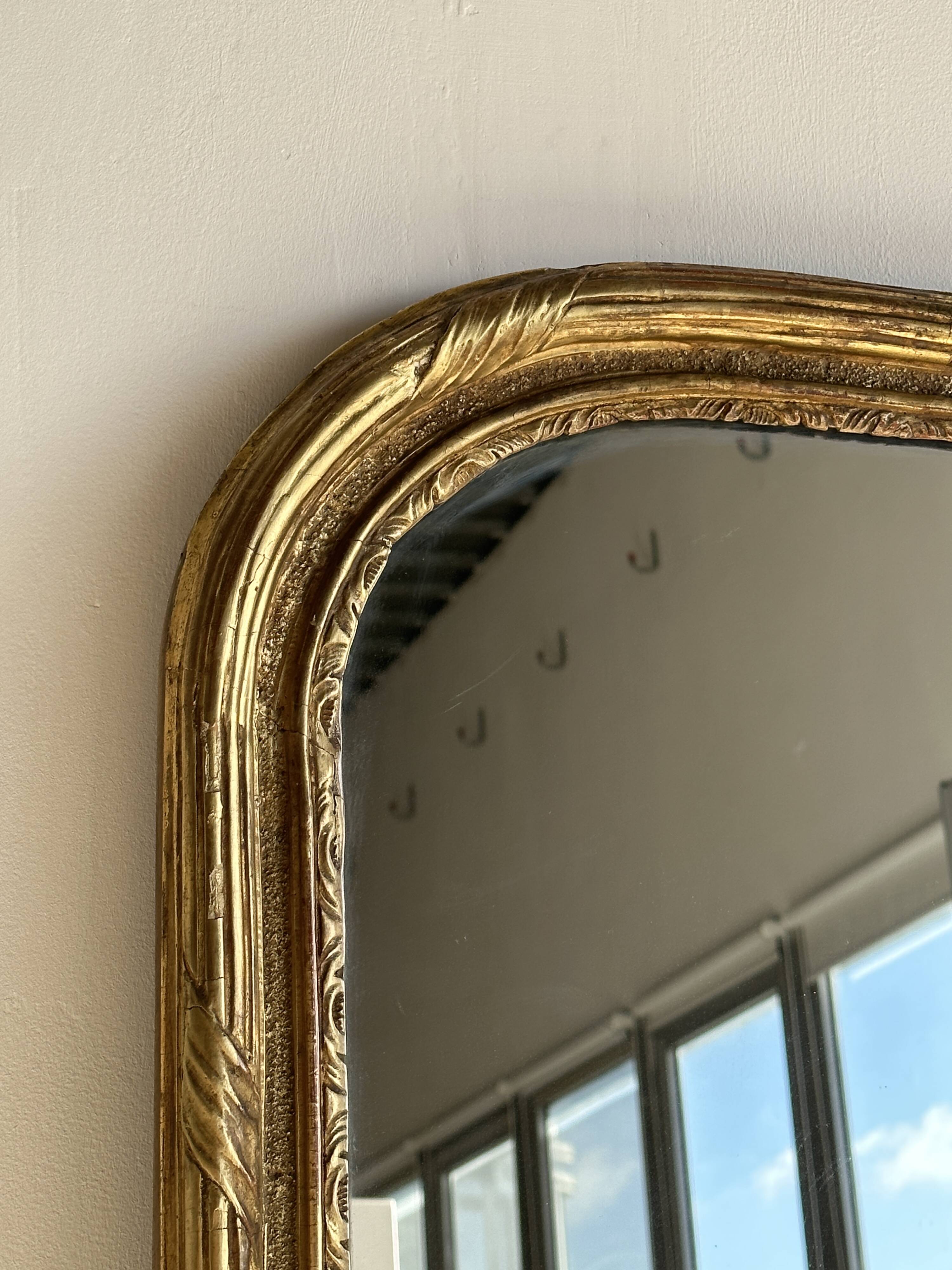 Large gilded mirror 19th century rounded corners mercury glass Louis XVI style