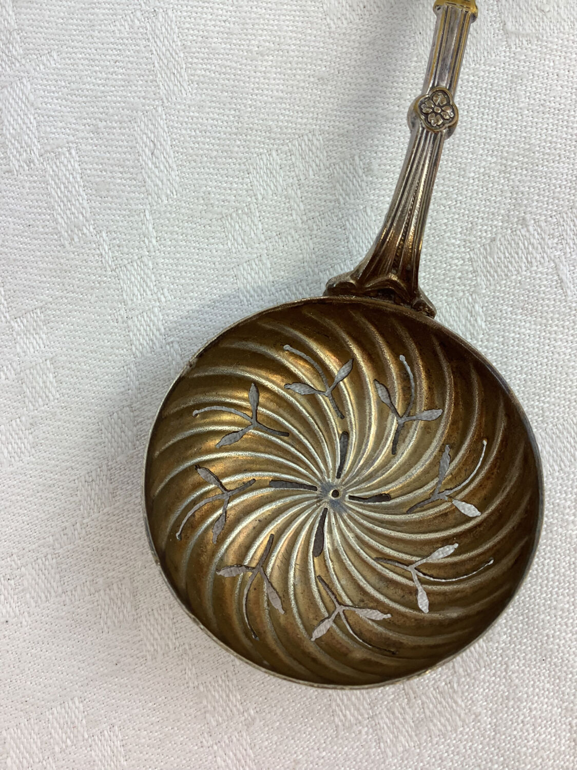 Old sprinkling spoon