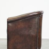 luxury dark leather club chair with English-style ball feet