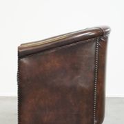 luxury dark leather club chair with English-style ball feet