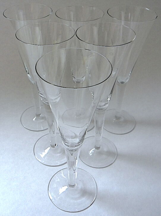 Suite of six colorless crystal champagne flutes