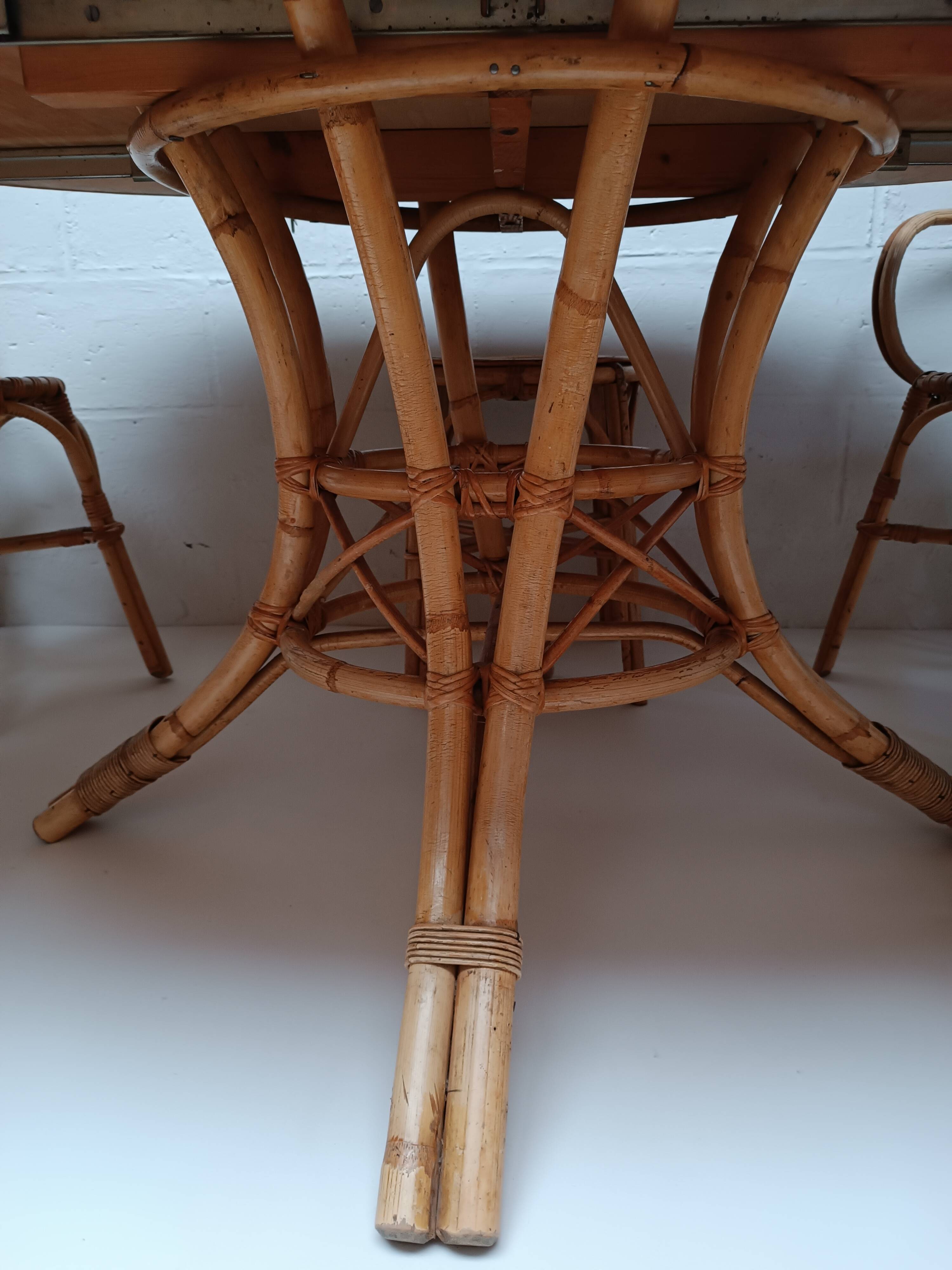 Bamboo table with extensions, 3 chairs and 3 stools from the 1960s.
