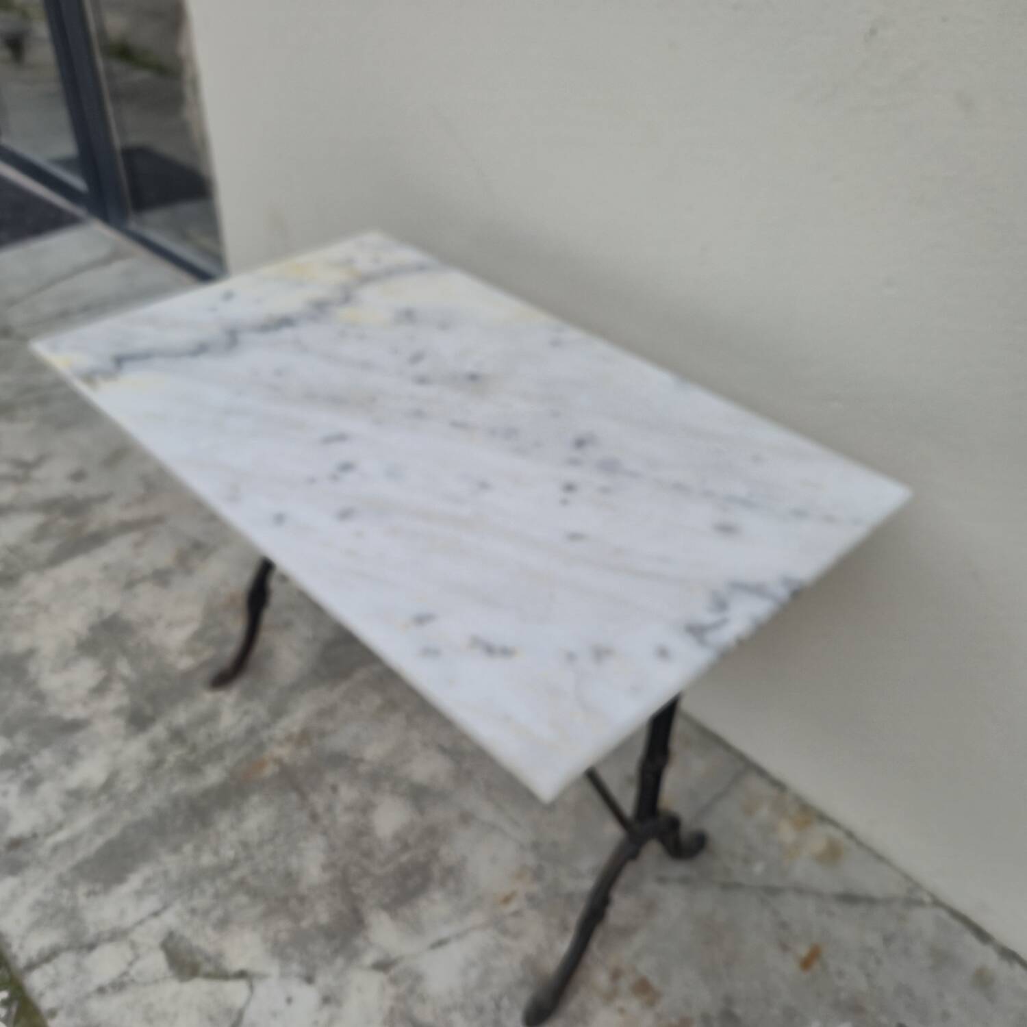 Antique cast iron and marble bistro restaurant table
