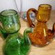 Oil and winery in amber and green sulphur glass
