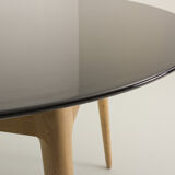 Round table, black lacquered top, solid oak base