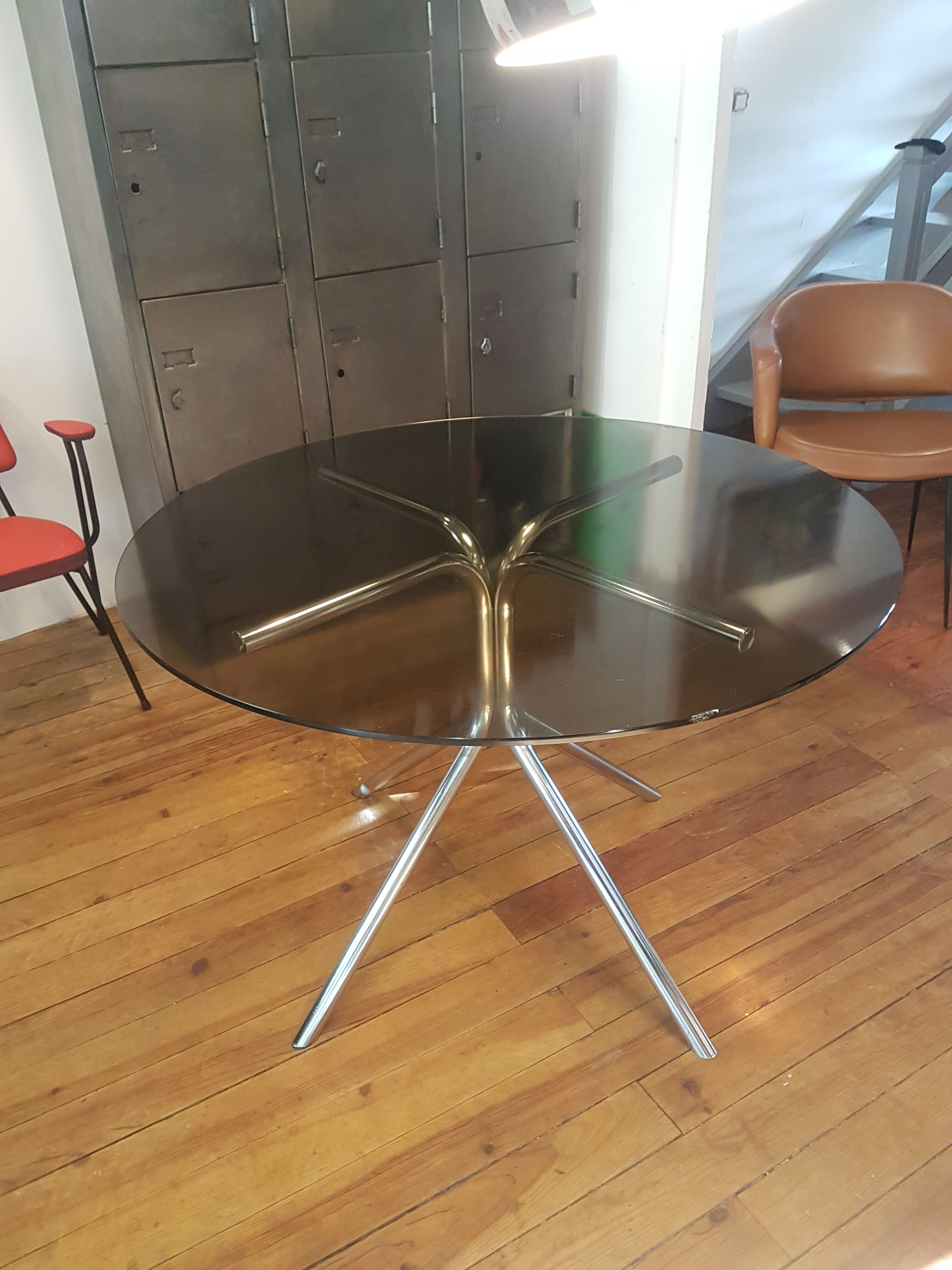 Smoked glass round table and chrome foot