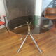 Smoked glass round table and chrome foot