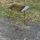 Mid-century modern brass and smoked glass side table with integrated magazine holder, 1970s