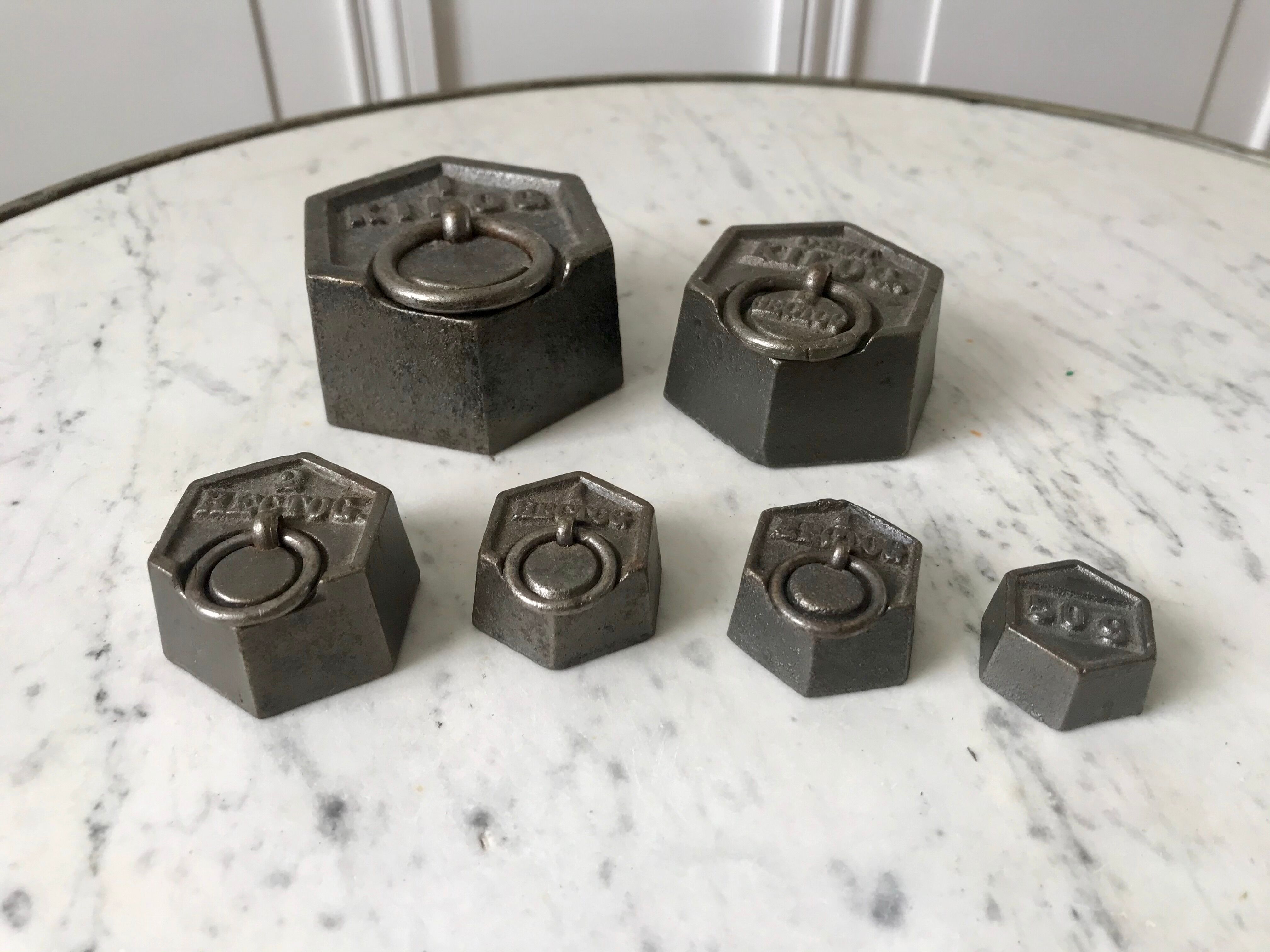 set of old measuring weights early twentieth century