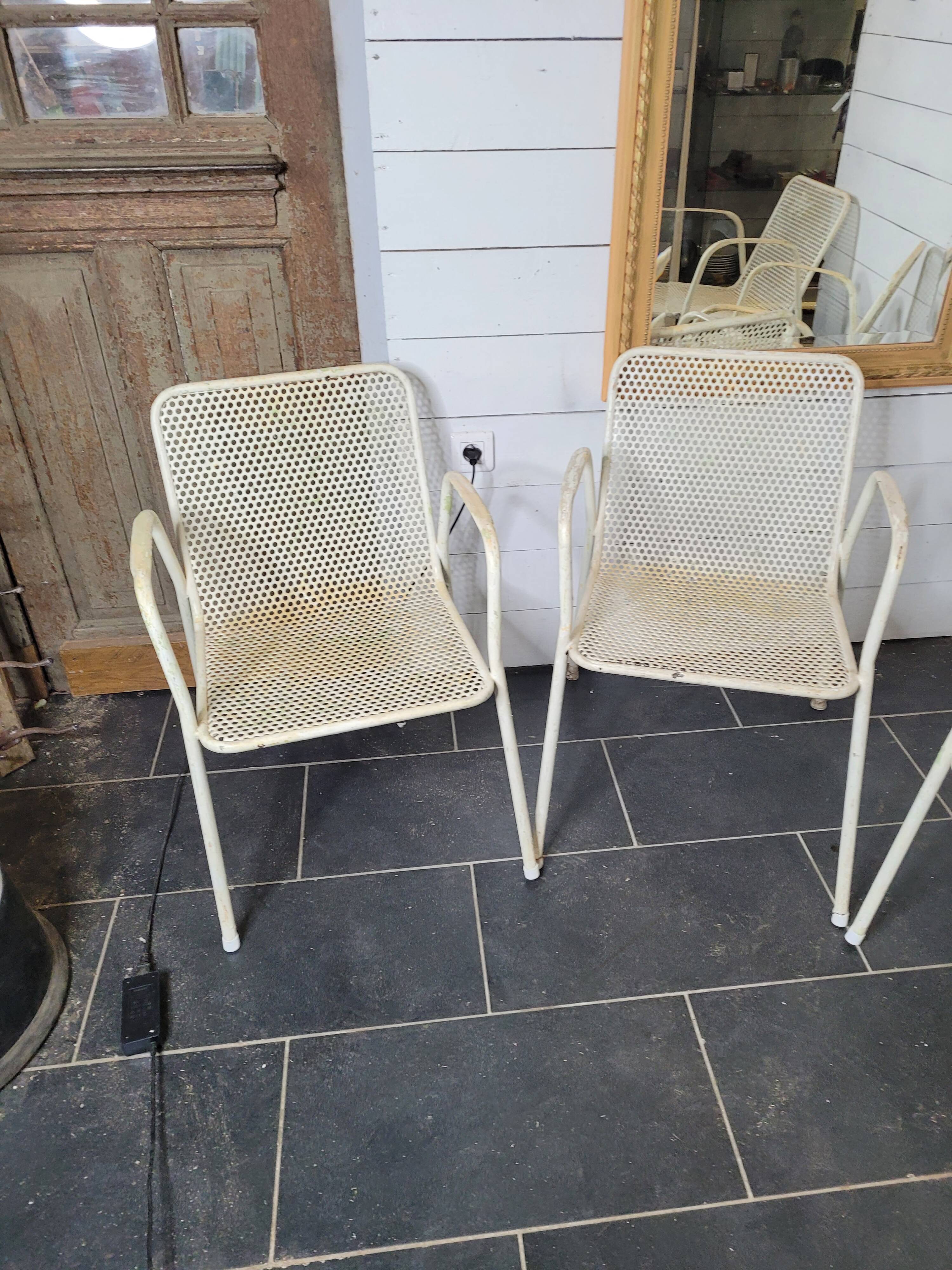 4 perforated metal garden armchairs