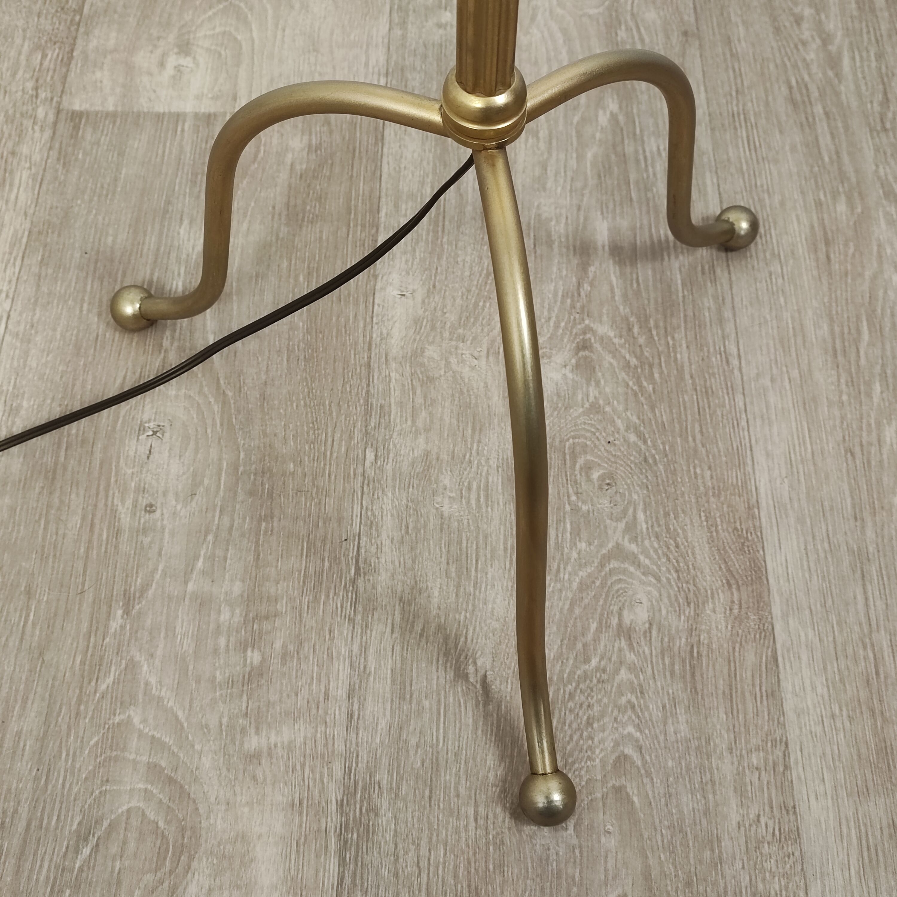 Golden tripod floor lamp