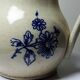 Fine earthenware pitcher with blue decoration, attributed to Saint-Uze, 19th century.