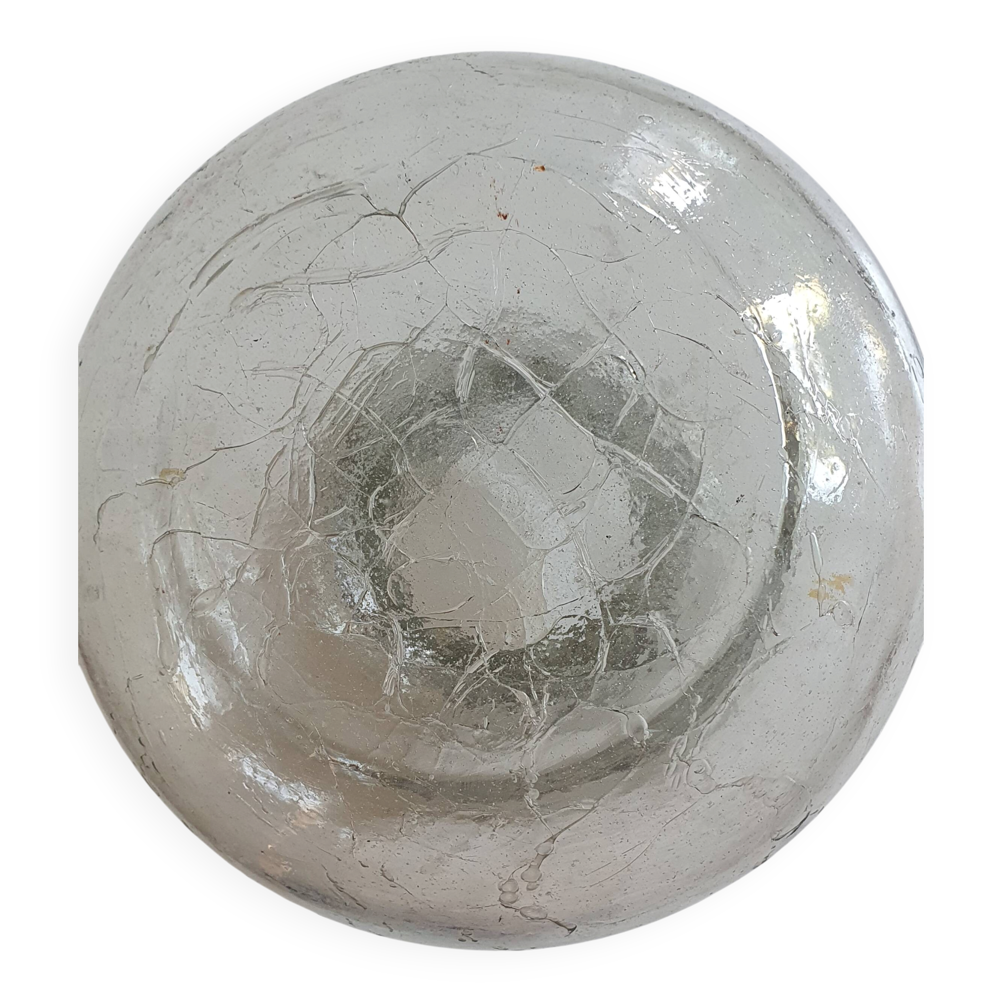 Cracked glass vase encircled with wrought iron.
