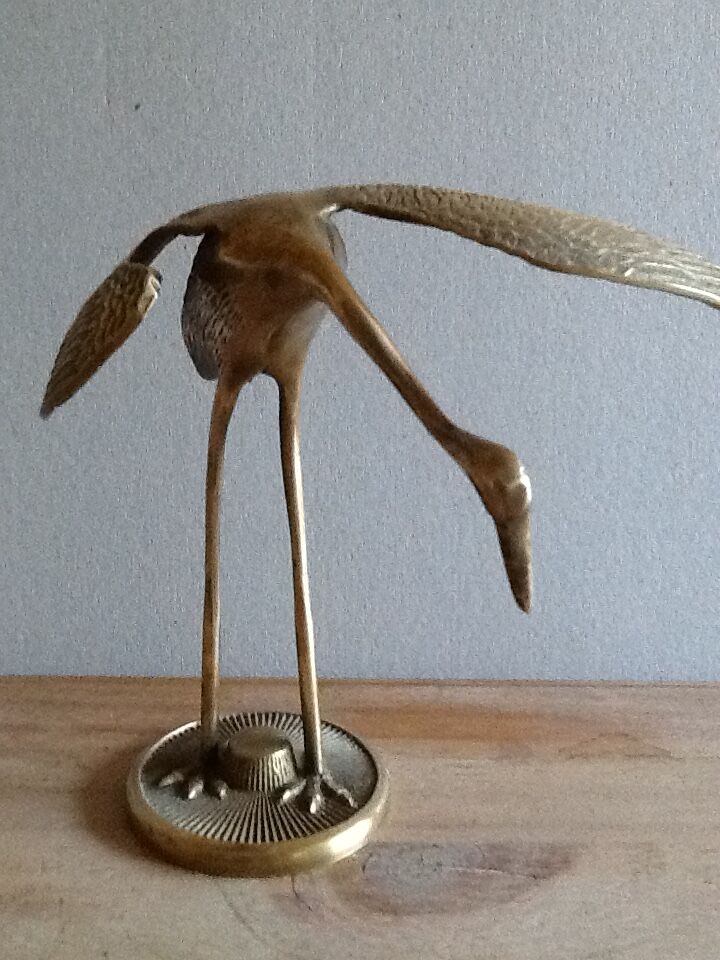 Bird takes off brass