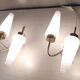 Asymmetrical brass wall lights with opaline shades, 1950s-60s.